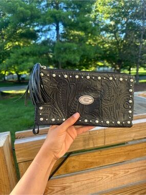 Embossed Black Leather Wristlet Clutch with Tassel and Stud Detail